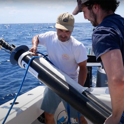 From left, Michael Zedelmair and Miles Mallinger, both of Seatrec, deploy a float with one of the company’s SL1 power modules in the Gulf of Mexico